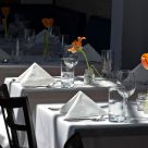 White Clothed Tables Ready for Action