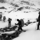 Hikers crossing a stream on Grossvenediger