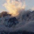 Clouds At Sunset Against The Mountains