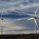 Two Windmills Alike At Sunset