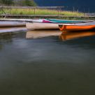 Canoes Reflect