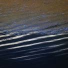 Sand Patterns And Colorful Water