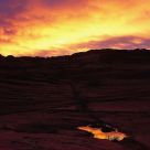 Red Sky, Land, And Water