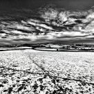 Winter Sky with Crossing Snow Tracks