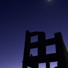 Moonset at twilight over ghost town opf Rhyolite, Nevada