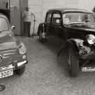 Two old cars and an elder man