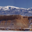 Wildcat Mesa in front of Snow Caped Henry Mountains 
