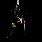 Clown playing saxofone