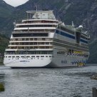 Cruise ship visits Geiranger fjord / Norway