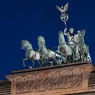 Quadriga, steering her chariot on top of the Brandenburg Gate