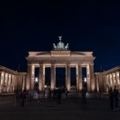 Night owls of various kinds lingering at the Brandenburg Gate
