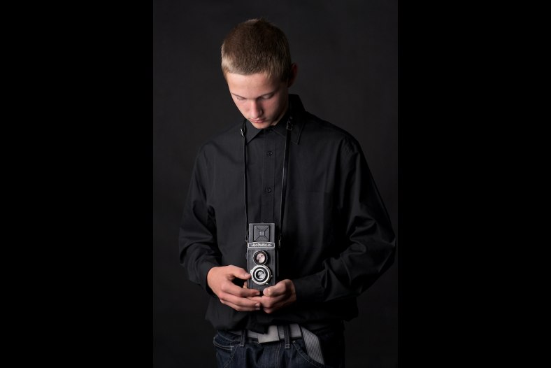 Young photographer old camera