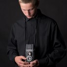 Young photographer old camera