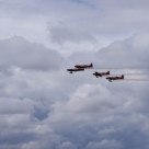 Puffy Clouds and Plane Smoke
