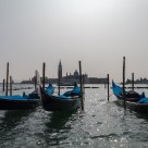 Gondolas with San Giorgio Maggiore in the background at noon
