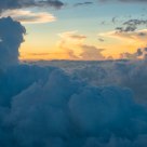 sunset and clouds seen from the window of the plane 