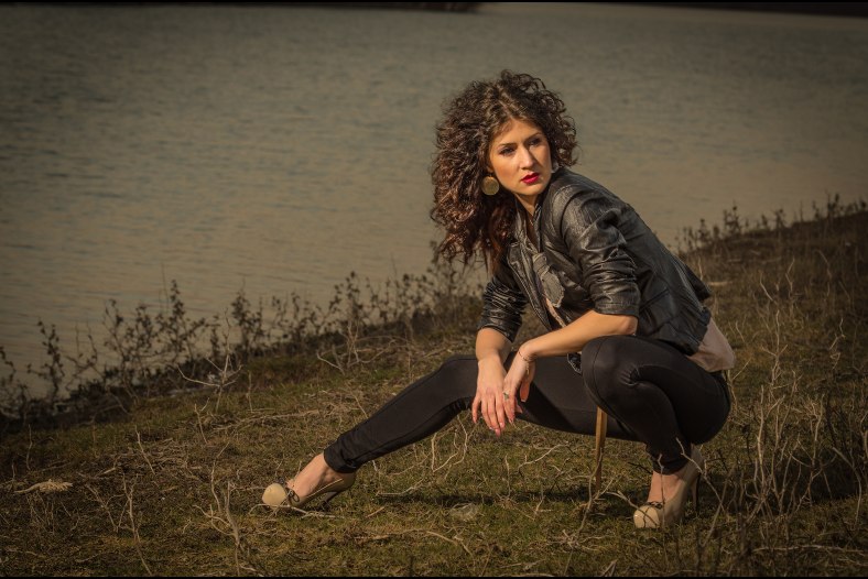 By the river.