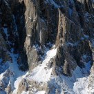 Snowy Rocky Crag At Winter